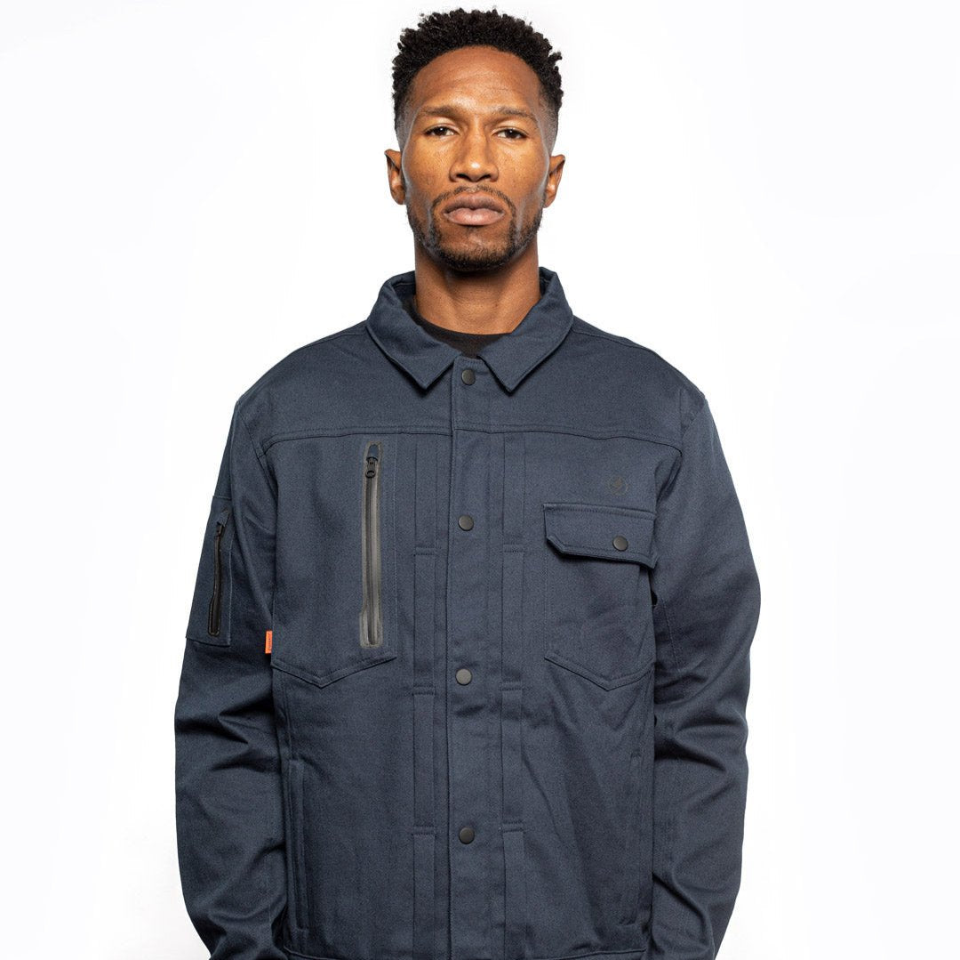 Male model wearing Anvil Chore Jacket in midnight colorway. @color_midnight