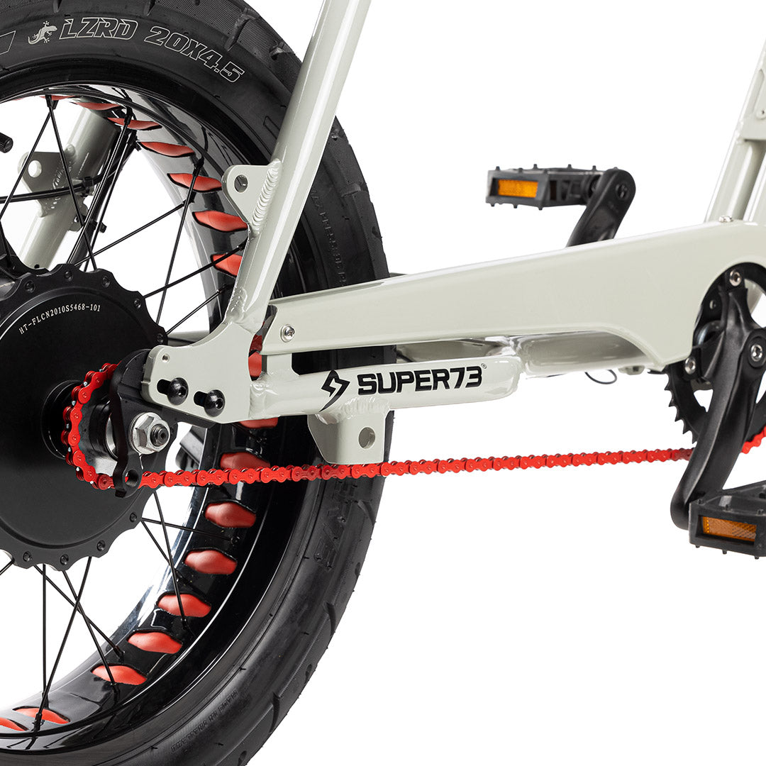 Red chain on bike with white background. @color_red