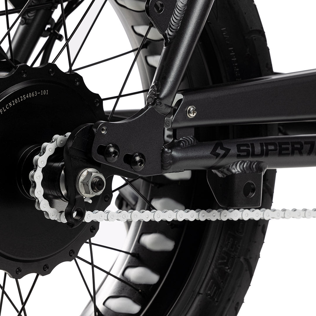 Close up shot of white chain on bike with white background. @color_white